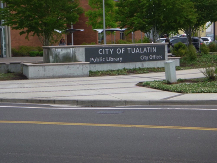 Sign for City of Tualatin Public Library and City Offices - sidewalks - parking lot